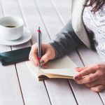 Woman, write, notepad — Stylish Wall Panelling Options for Living Rooms, Bedrooms, and Hallways